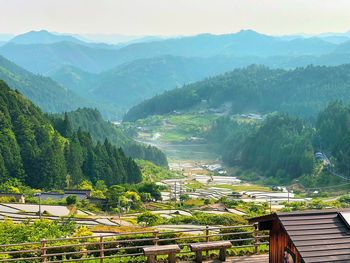 High angle view of trees and mountains against sky