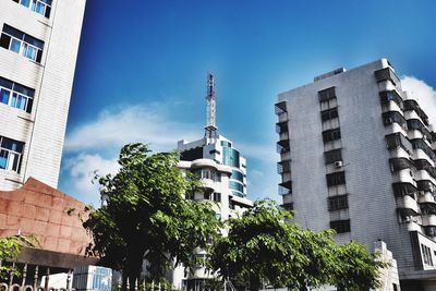 Low angle view of buildings against blue sky