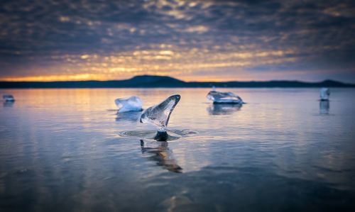 Sunset on the ice lake