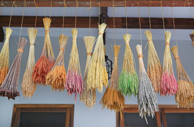 Low angle view of clothes hanging on roof against building