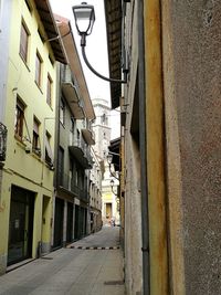 Houses amidst city against sky