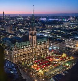 High angle view of city lit up at dusk