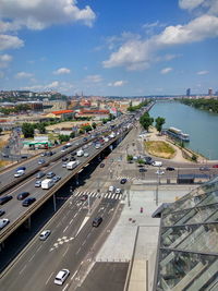 High angle view of cars on bridge and street in city