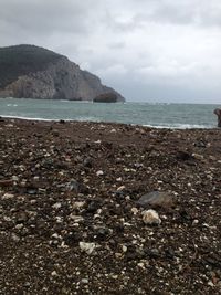 Scenic view of sea against cloudy sky