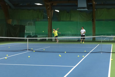 Men playing tennis