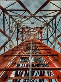 A bottom-up view of a cell tower steps in calabanga, camarines sur, philippines.