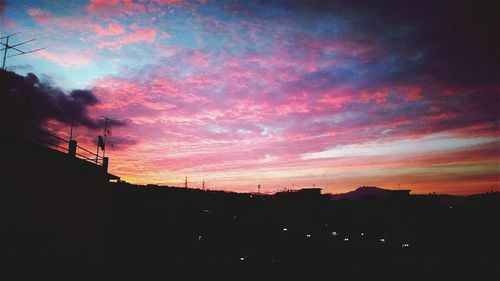 Low angle view of dramatic sky during sunset