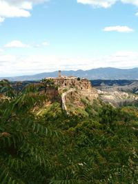 Old ruins on mountain against sky