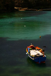 High angle view of boat moored in lake