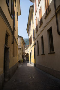 Narrow alley amidst buildings in town