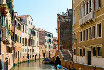 Boats on canal in city