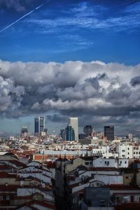 High angle view of buildings in city against sky