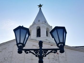 Low angle view of bell tower against sky