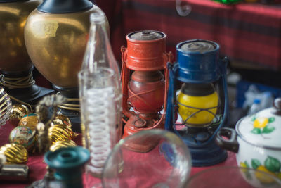 Close-up of multi colored bottles on table