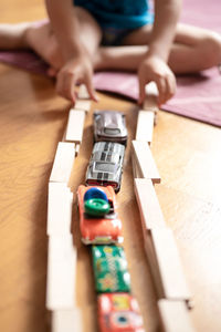 Close-up of baby playing with toy on table