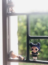 Close-up of toy by window