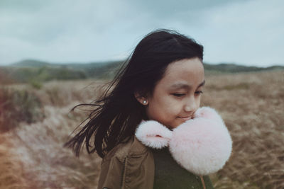 Close-up of beautiful woman against sky