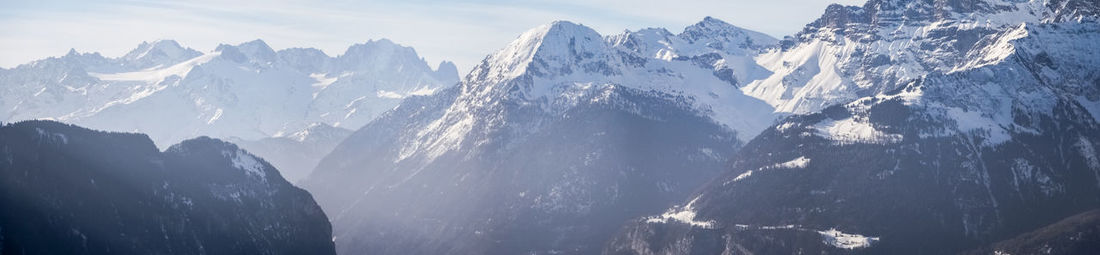 Scenic view of snowcapped mountains against sky