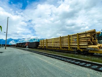 Train on railroad tracks against sky