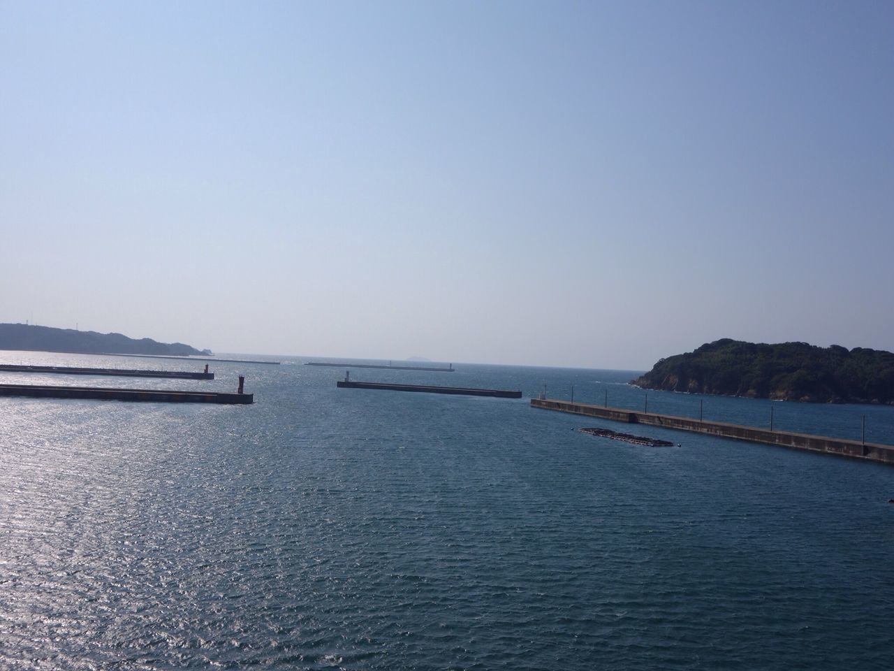 sea, water, horizon over water, clear sky, copy space, tranquil scene, tranquility, scenics, beauty in nature, beach, nature, blue, seascape, nautical vessel, transportation, shore, idyllic, coastline, calm, rippled