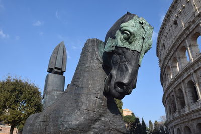 Low angle view of statue against sky