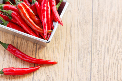 High angle view of red chili pepper on table
