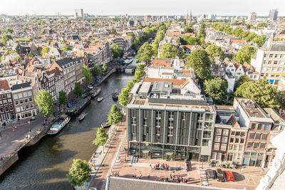 High angle view of buildings and trees in city