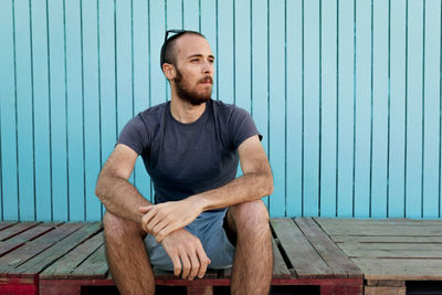 Portrait of man sitting outdoors