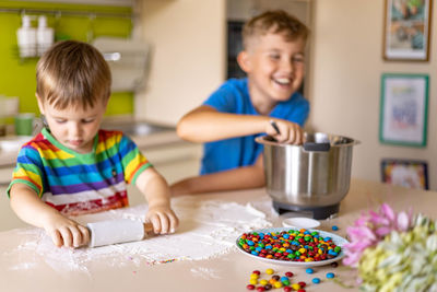 High angle view of boy having food at home