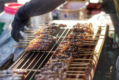 Cropped hand preparing food