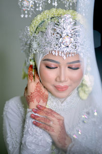 Portrait of smiling young woman wearing mask