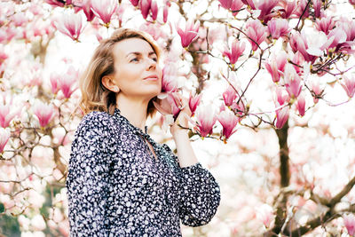 Portrait of woman with pink flowers