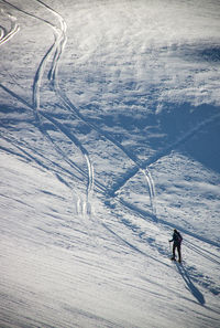 High angle view of person skiing on snowcapped mountain