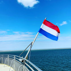 Sailboat on sea against sky