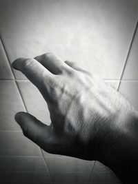 High angle view of hands on floor at home