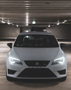 Car in parking lot at night