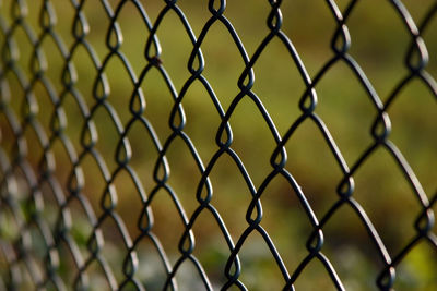 Chainlink fence seen through chainlink fence