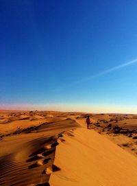 Scenic view of desert against clear sky