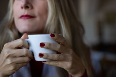 Portrait of woman drinking coffee