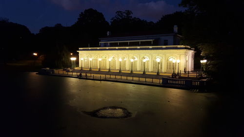 Illuminated building against sky at night