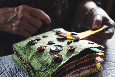 Felt book covered with colorful buttons and embroidery