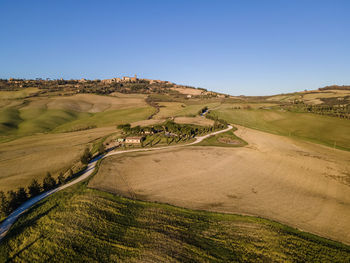 Scenic view of land against clear blue sky