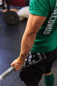 Low section of man exercising at gym