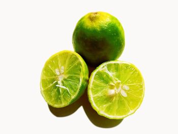 Close-up of fruits against white background