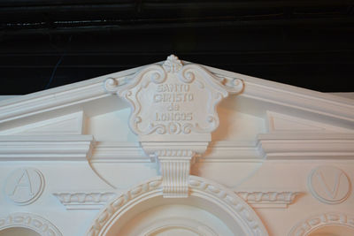 Low angle view of text on building