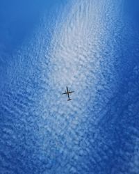 Low angle view of airplane flying in sky