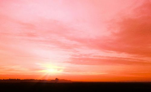 Scenic view of sunset over landscape