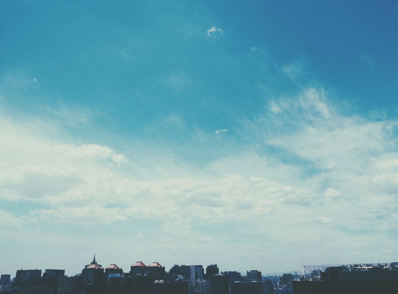 building exterior, architecture, built structure, city, sky, cityscape, blue, cloud - sky, residential building, building, residential structure, low angle view, cloud, residential district, skyscraper, outdoors, city life, day, no people, urban skyline