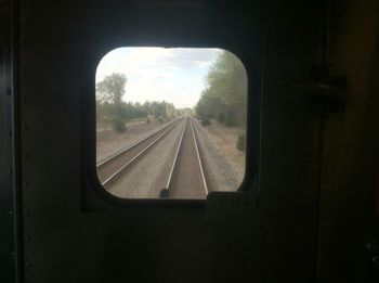 Railroad track seen through train windshield