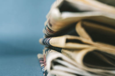 Close-up of old newspapers on table